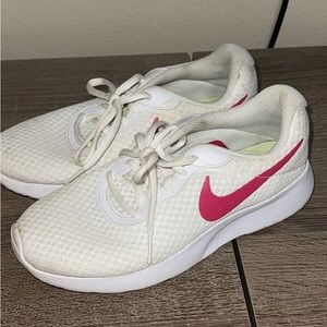 Nike running shoes with red swish